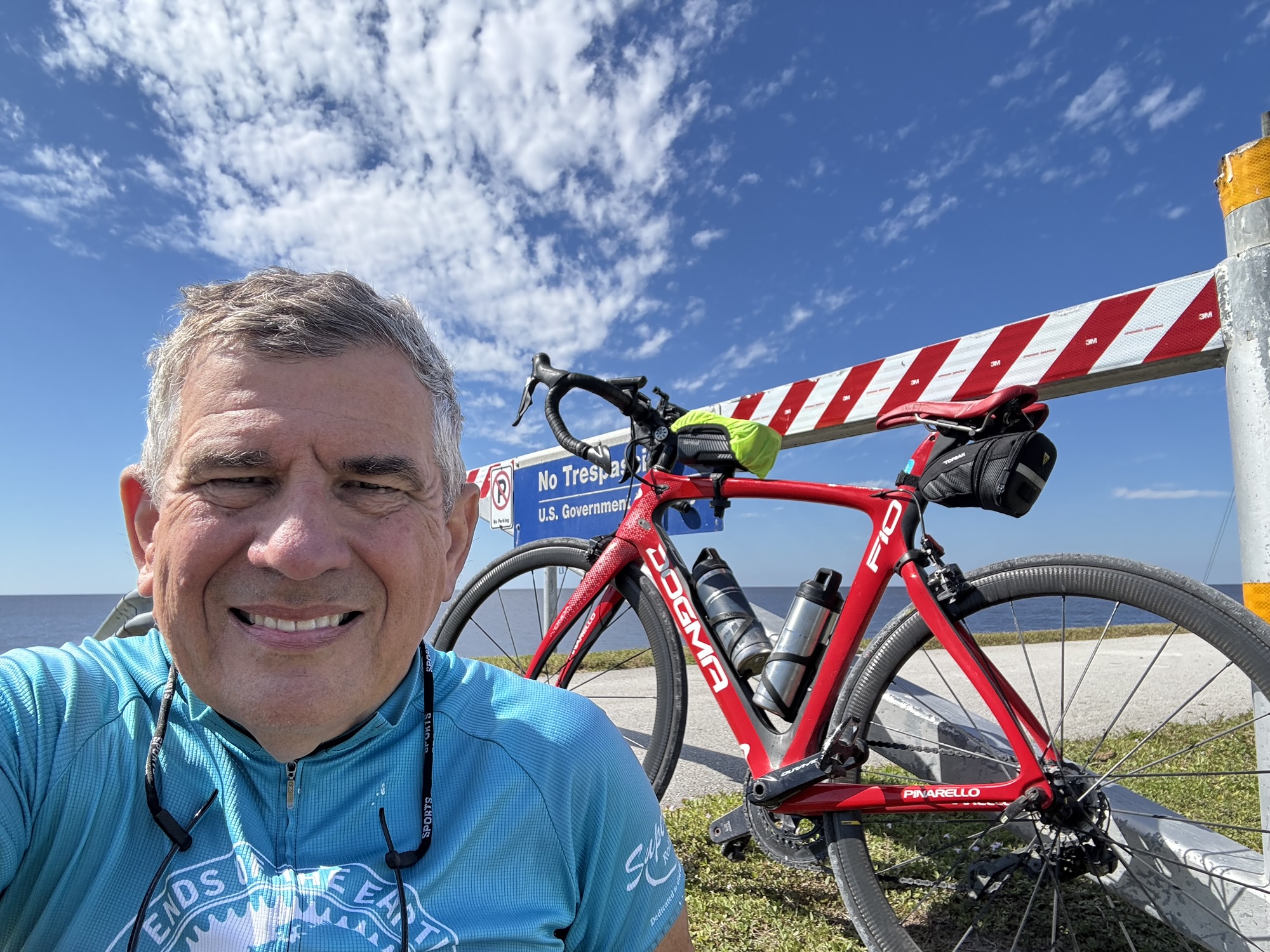 Happy to have finished the Lake Okeechobee section of the Florida Trail today! After having previously biked from Lakeport to Port Mayaca and the return trip, today I completed biking completely around the lake by going from Clewiston in the south to Port Myaca on the east side of the lake. This 61-mile trip was very grueling due to the strong northerly headwind going to Port Mayaca. I was also very surprised to see that the trail degraded to a dirt/pebble-filled path for nearly 1/3 of the trip after starting on a wide, paved pathway. My Pinarello F10 Dogma road bike was not a good choice for the degraded pathway, so I returned using the highway surrounding the lake. The road had lots of large trucks but did have a good shoulder. For those choosing to bike ride around Lake Okeechobee, I highly recommend using the existing highways rather than the actual Florida Trail on the dike.
